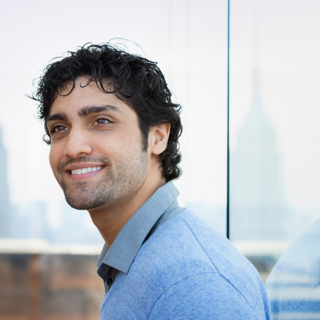 Smiling man reflecting success with the best Muslim matchmaker in USA | Real matchmaking success story